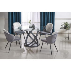 Okrogla miza PTICA je atraktivna in sodobna miza iz stekla. Podnožje je iz kvalitetne kovine v črni barvi.