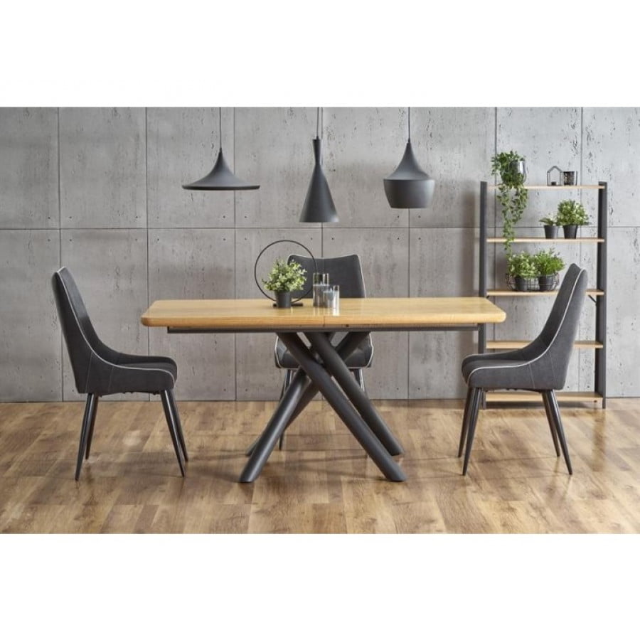 Raztegljiva jedilna miza DEREK je privlačna miza sodobnih linij. Kombinira ljubezen do lesa in moč kovine. V raztegnjeni poziciji lahko za mizo sedi osem ali