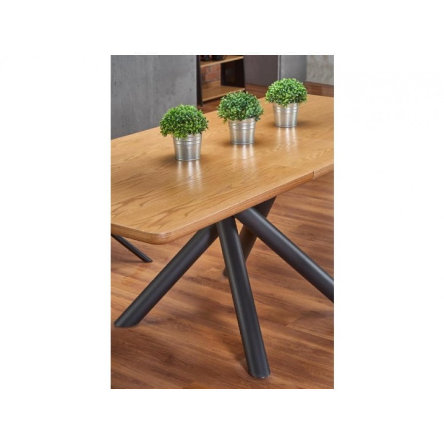Raztegljiva jedilna miza DEREK je privlačna miza sodobnih linij. Kombinira ljubezen do lesa in moč kovine. V raztegnjeni poziciji lahko za mizo sedi osem ali