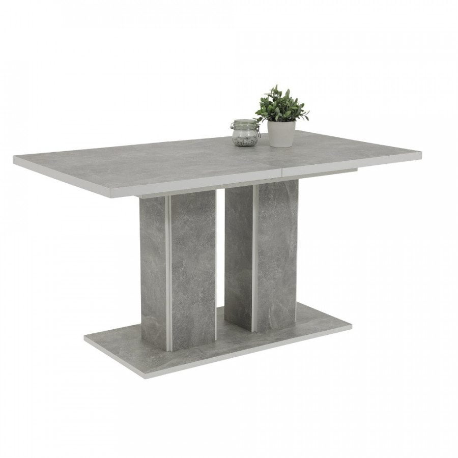 Moderna raztegljiva miza v nevtralni sivi barvi, z vzorcem betona. Miza je v celoti narejena iz iverala, oblečenega v melamin. Namizna plošča ima v sredini