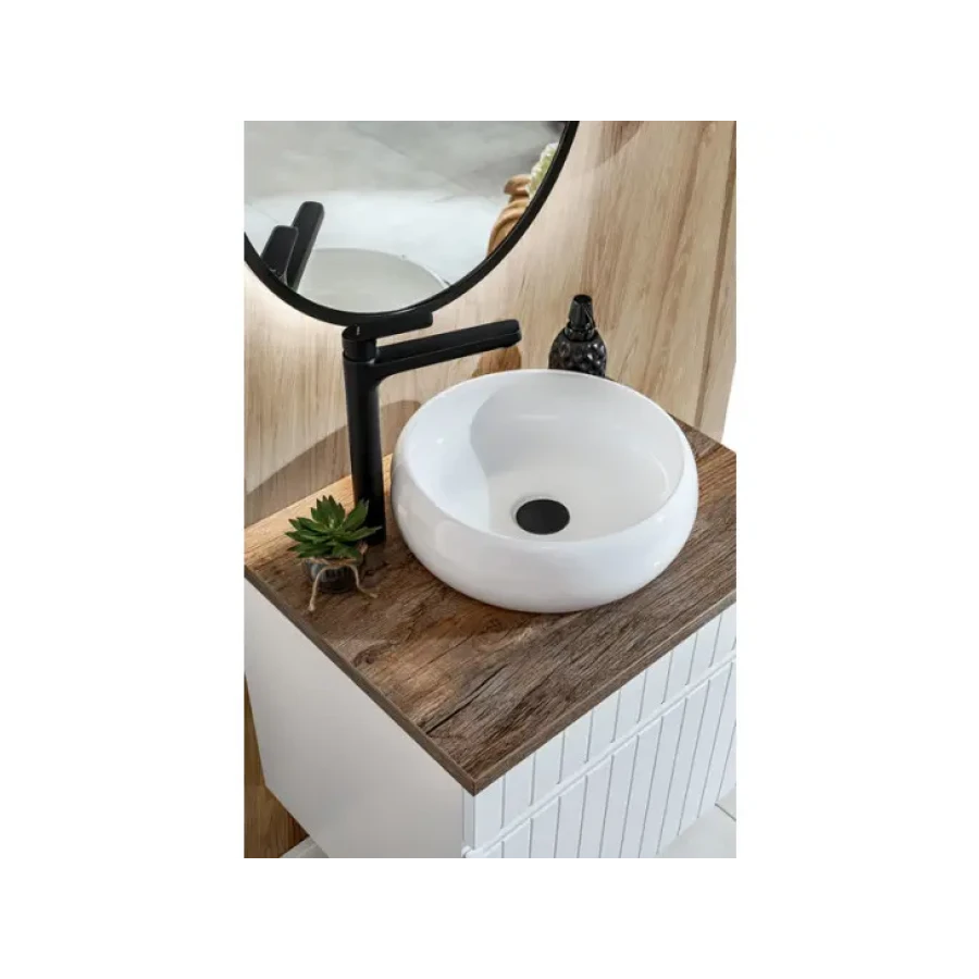 Nadpultni kopalniški umivalnik JAGODA 30 je trpežen umivalnik sodobnih linij. Narejen je iz keramike v beli barvi in se lepo poda v vsakršno kopalnico.