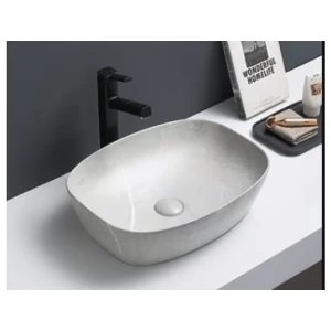 Nadpultni kopalniški umivalnik ŽAN 1 je narejen iz kvalitetne keramike. Zaradi svoje mat barve omogoča enostavno čiščenje. Dobavljiv je v sivi mat barvi.