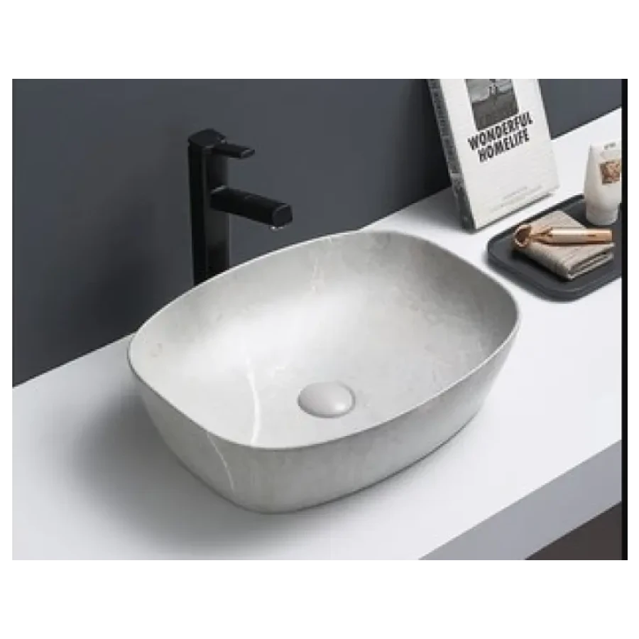 Nadpultni kopalniški umivalnik ŽAN 1 je narejen iz kvalitetne keramike. Zaradi svoje mat barve omogoča enostavno čiščenje. Dobavljiv je v sivi mat barvi.