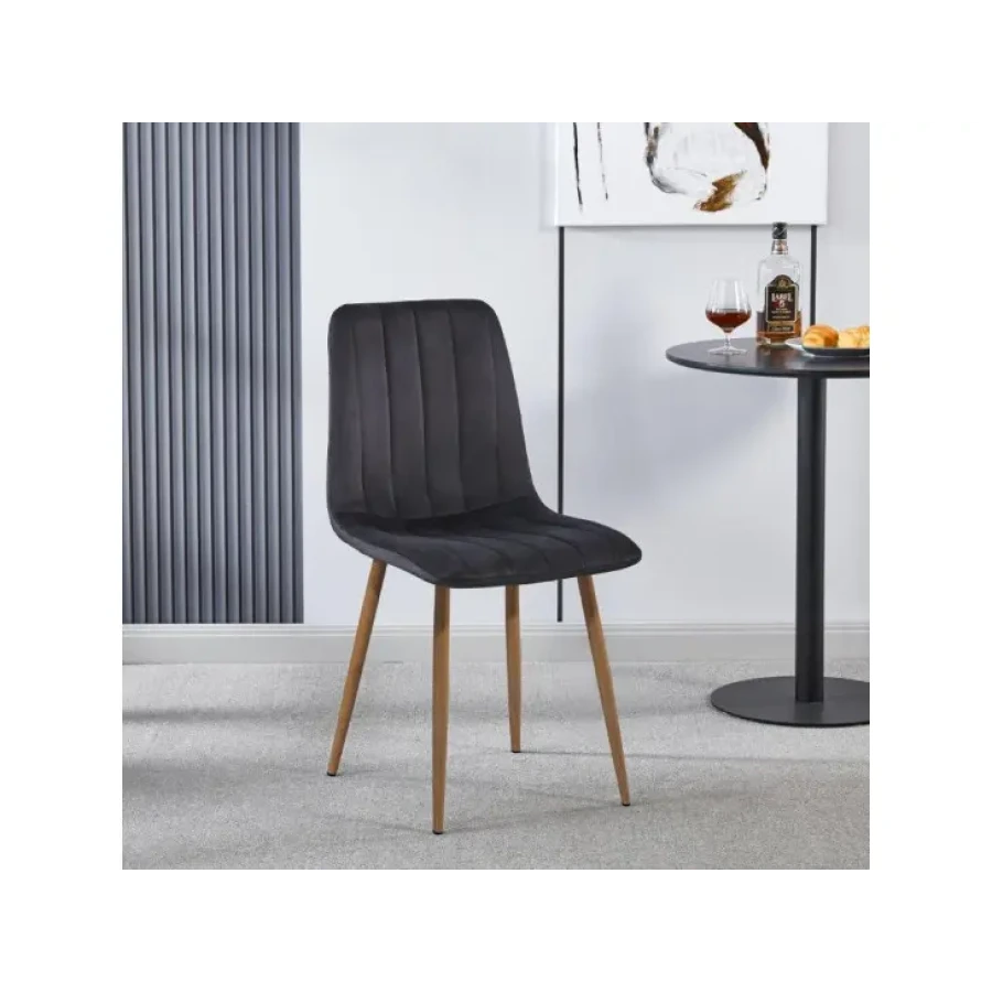 Jedilni stol FOXY velvet črna je odlična rešitev za kombiniranje v minimalističen ali industrijski stil prostora. Kombinacija črnega blaga s hrastovmi