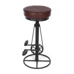 Barski stol CYCLE temno rjav . Barski stol CYCLE je dobavljiv v črno-rjavi kombinaciji. Noga je kovinska, sedež je oblečen v usnje. širina: Ø42cm višina: