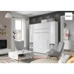 Dodatna omara za posteljo v omari METULJ1 - bela visoki sijaj . Visoka, navpična omara za knjige z vrati, dvema vdolbinama in predalom, je na voljo v