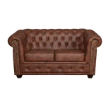 Dvosed LORENA 2 rjava . Osvežite svojo dnevno sobo z vzmetenim trosedom LORENA, ki je udoben in kvaliteten. Oblazinjen je v umetnem usnju. Lesene nogice pa mu