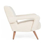 Fotelj BERNA bela . Fotelj BERNA bela ima okvir iz lesa in vezane plošče, noge imajo nastavljive nogice. Prevleka je iz poliestra z učinkom volne. Polnilo