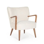 Fotelj MORITZ bela . Fotelj MORITZ bel je narejen iz lesa ter prevleko iz poliestra ki daja učinek volne. Na dotik je prijeten in mehek. Material: - Les -