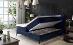 Boxspring postelja ARITO je oblečena v visoko kakovostno tkanino. Čvrsta vzmetnica je nameščena na robustnem oblazinjenem okvirju, s prostorom za