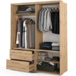 Garderobna omara KLARA . Garderobnao mara KLARA je dvokrilna garderobna omara z ogledalom, dvema palicama, dvema predaloma, policami in osvetlitvijo. En del na