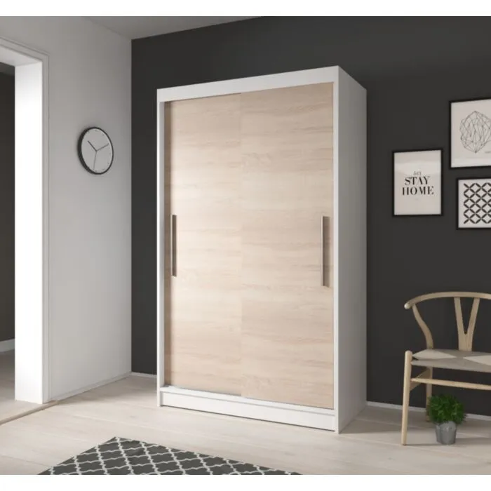 Garderobna omara ROLAND Garderobna omara ROLAND . Garderobna omara ROLAND je primerna za vse spalnice. Je zelo prostorna. Na levi strani ima zelo prostorne police, na desni strani pa