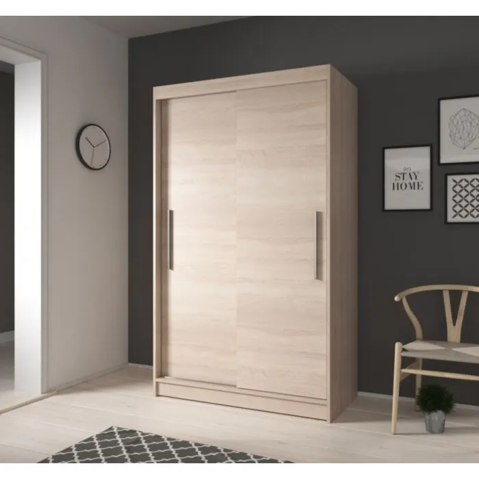 Garderobna omara ROLAND  2 Garderobna omara ROLAND 2 . Garderobna omara ROLAND 2 je primerna za vse spalnice. Je zelo prostorna. Na levi strani ima zelo prostorne police, na desni strani