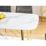 Jedilna miza IZABELA . Jedilna miza IZABELA je privlačna, elegantna in uporabna. Izgled marmorja ustvarja skupaj z zlatimi nogicami občutek razkošja v