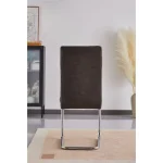 Jedilni stol DANA 2 je elegantne oblike in kakovostne izdelave. Njegov dizajn se bo podal v vsako jedilnico. Oblazinjen je v sivem blagu, ki na videz spominja