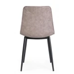 Jedilni stol KYRA . Jedilni kuhinjski stol KYRA je modernega dizajna. Oblazinjen je v bež umetno usnje, ki zagotavlja preprosto vzdrževanje. Noge so kovinske