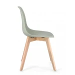 Jedilni stol SYSTEM zelen . Jedilni stol SYSTEM zelen je eleganten kos pohištva, ki da poseben čar vašemu prostoru. Noge ima narejene iz bukovega lesa.