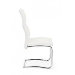 Jedilni stol THELMA bela . Jedilni stol THELMA bela ima jekleni okvir in kromirane noge. Polnilo je iz poliuretanske pene, oblečen je v umetno usnje.