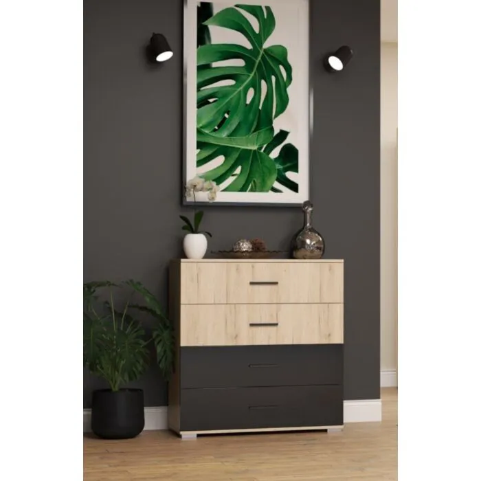 Komoda DULE . Komoda DULE je primerna za vsako spalnico. Narejena je iz kvalitetne laminirane plošče in ima ABS robove. Vsebuje 4 predale. Odlično se poda h