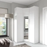 Kotna garderobna omara EMILI 3 . Kotna garderobna omara EMILI 3 je izvirna in stilska. Izdelana iz laminirane plošče. Na voljo v več barvah. Garderobna