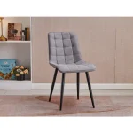 Kuhinjski stol TARIK siva tkanina . Kuhinjski stol TARIK sivo blago, v kombinaciji sivega prešitega blaga s črnimi kovinskimi nogami se poda v vsak ambient.