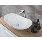 Nadpultni kopalniški umivalnik MERI je narejen iz keramike v beli mat barvi z vzorcom marmorja. Vsaki kopalnici bo dodal izgled elegance ter modernosti.