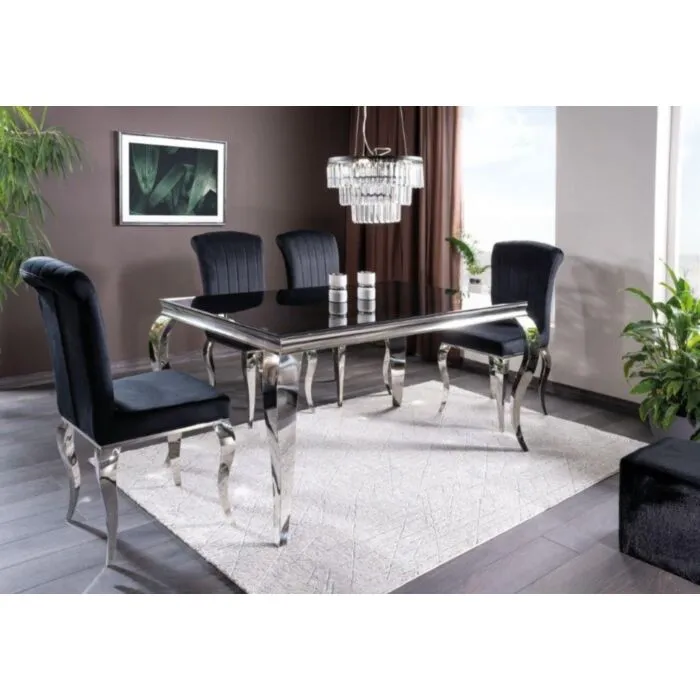 Steklena jedilna miza KRALJ Steklena jedilna miza KRALJ . Steklena jedilna miza KRALJ je primerna za vsako jedilnico. Mizna plošča je izdelana iz kaljenega stekla črne barve. Miza je